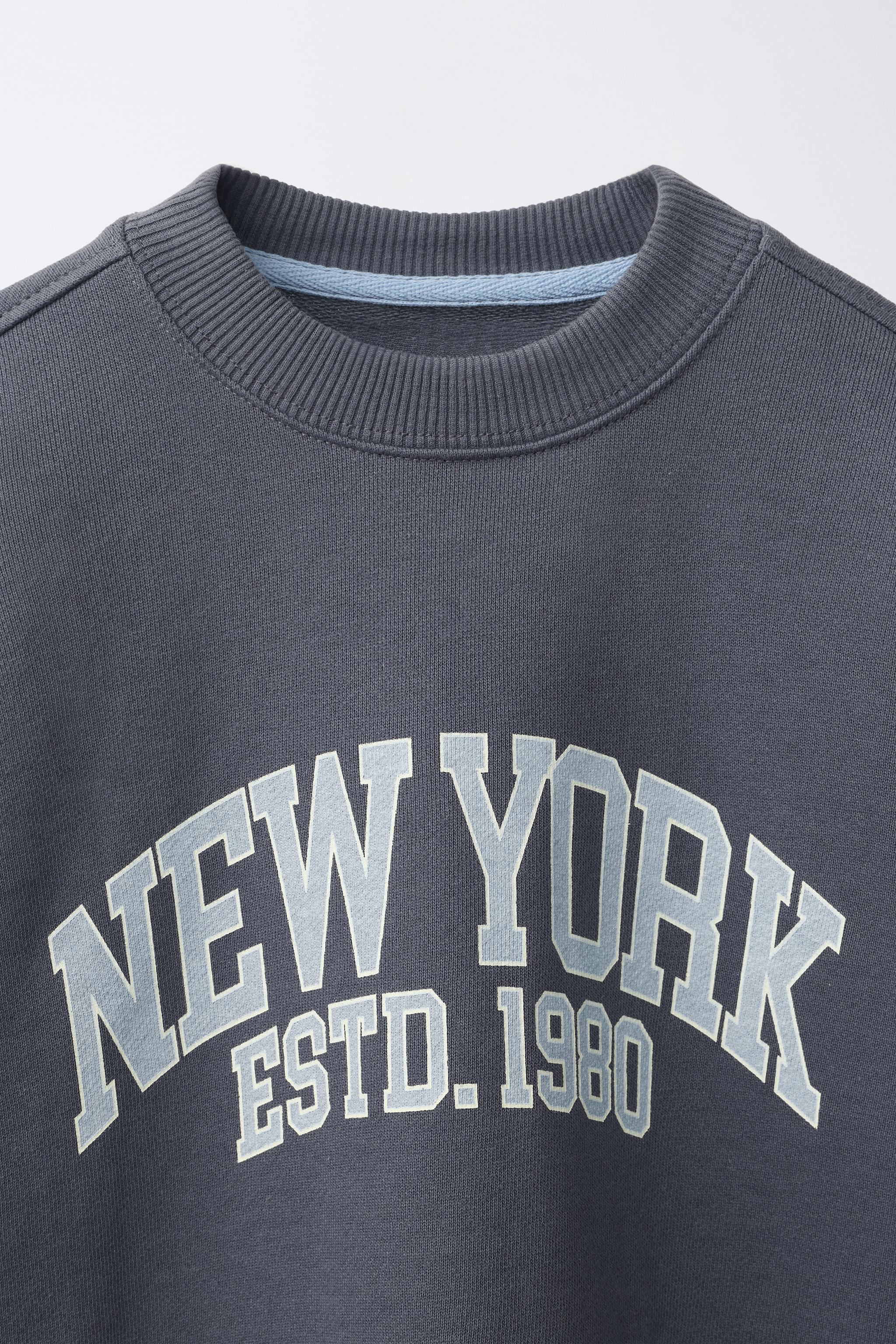 DOUBLE SLEEVE TEXT SWEATSHIRT